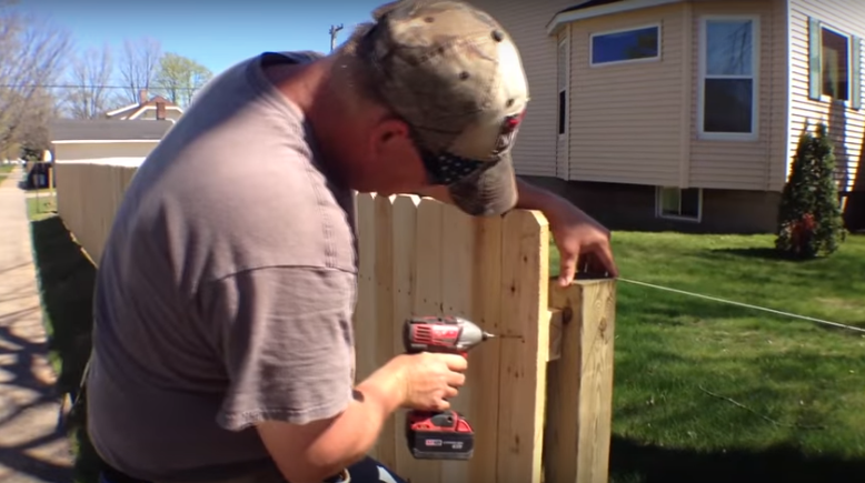 installing wooden fence